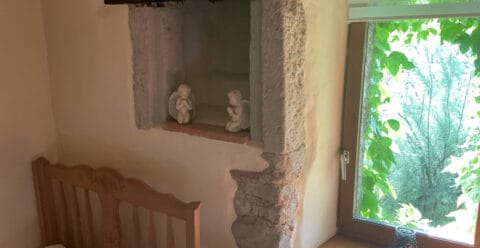Exposed oak beams and historic character details in the manoir.