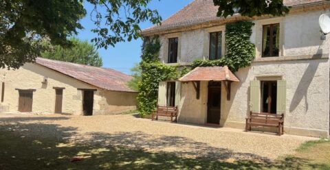 Six-bedroom 16th-century French manoir at Pie Pasquie in Vares, featuring private fenced pool, covered outdoor dining area and spacious grounds for families and pets.